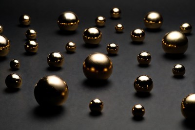 Shiny gold spheres on black background
