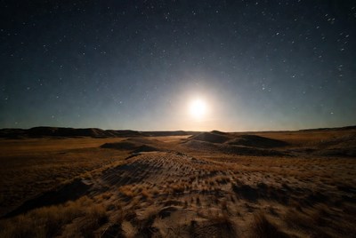 Full Moon Over Desert Landscape