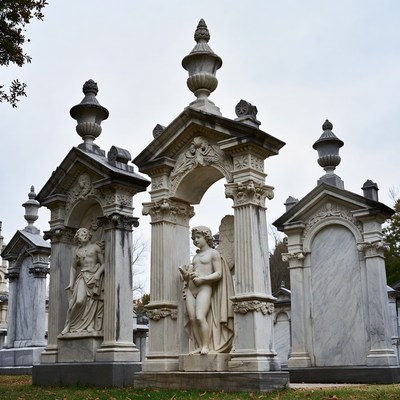 Ornate Cemetery Sculptures with Cherub Statue