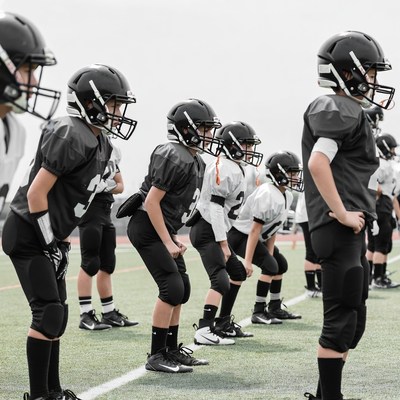 Youth football team in huddle