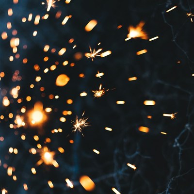 Sparks Flying on Dark Background