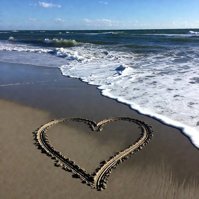 Heart Drawn in Sand by Ocean Waves