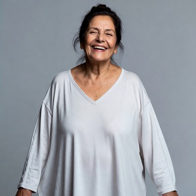 Smiling mature woman in white top