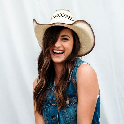 Smiling woman in cowboy hat