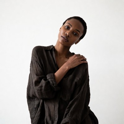 African-American woman in brown shirt