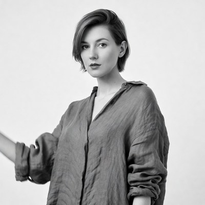 Woman with short hair in loose shirt