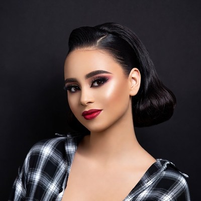Latina woman with sleek updo hairstyle