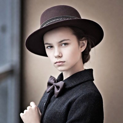Girl in burgundy hat and bowtie