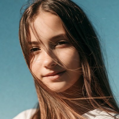 Teen girl smiling outdoors