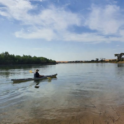 Man kayaking on river