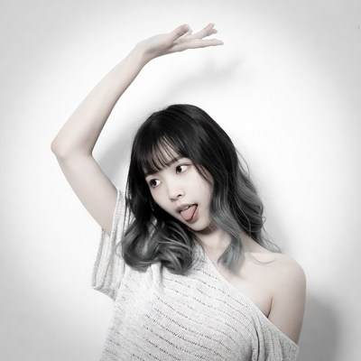 Asian woman sticking tongue out