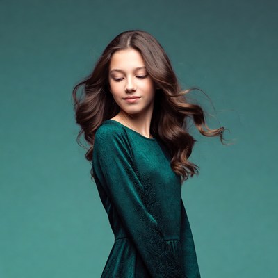 Teen girl in green velvet dress