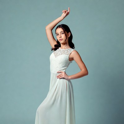 Young woman posing in white lace dress