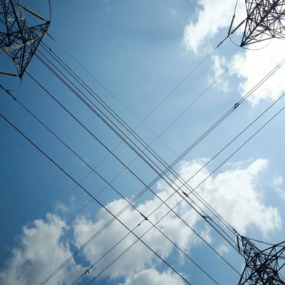 Electricity Pylons Against Blue Sky