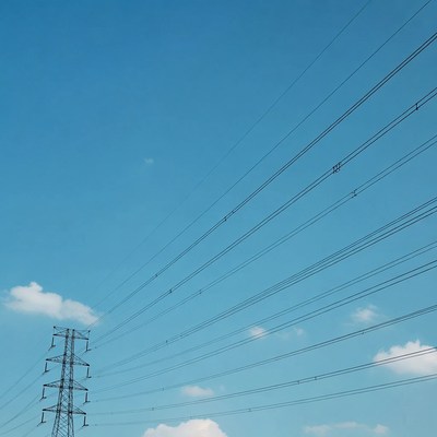 Electricity Pylon with Wires Against Blue Sky