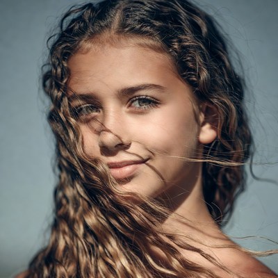Teen girl with curly brown hair