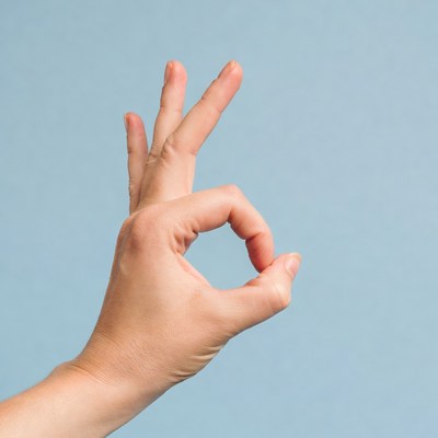 Hand making OK sign