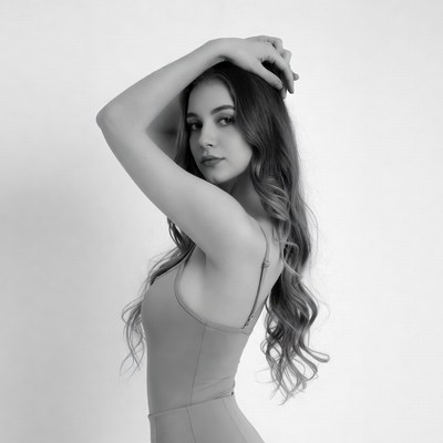 Young woman posing with hand on head