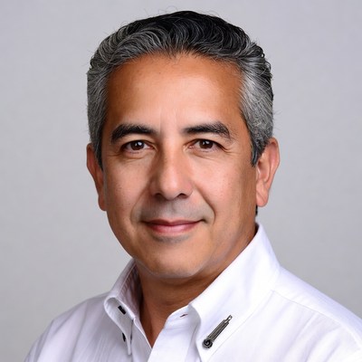 Smiling Latino man in white shirt