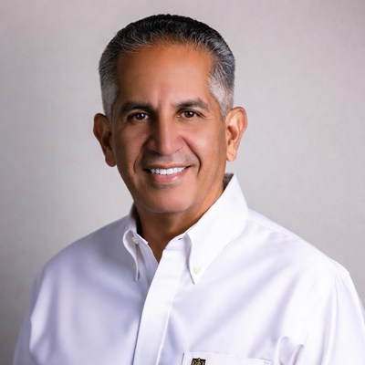 Smiling Middle Eastern man in white shirt