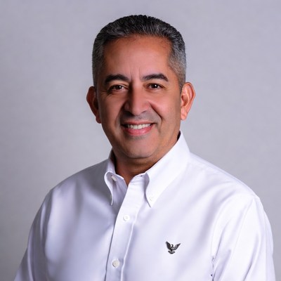 Smiling Middle Eastern man in white shirt