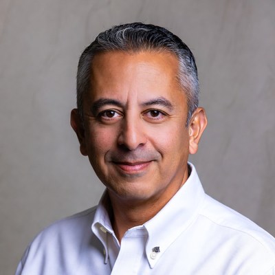 Smiling Middle Eastern man in white shirt