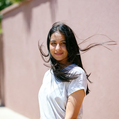 Smiling woman with flowing black hair
