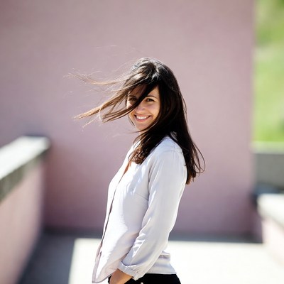 Smiling woman with wind-blown hair