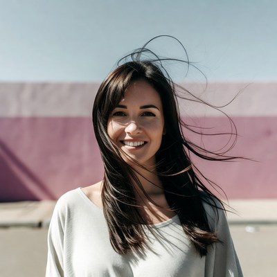 Smiling woman with flowing hair outdoors