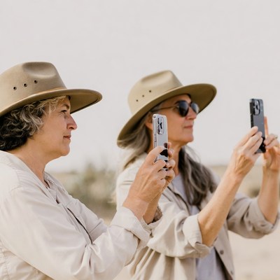 Two women taking selfie in desert