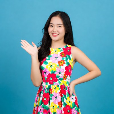Asian girl waving in floral dress
