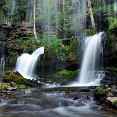 Waterfall cascading over mossy rocks