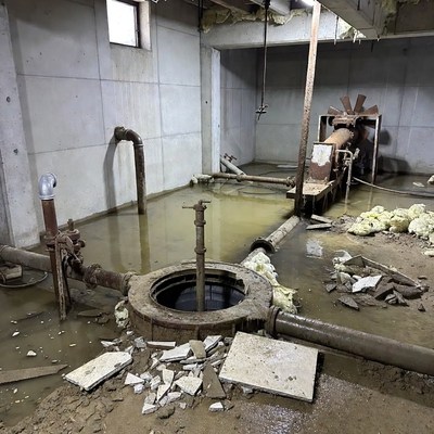 Flooded Abandoned Basement with Pipes