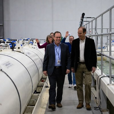 Group of executives touring industrial facility