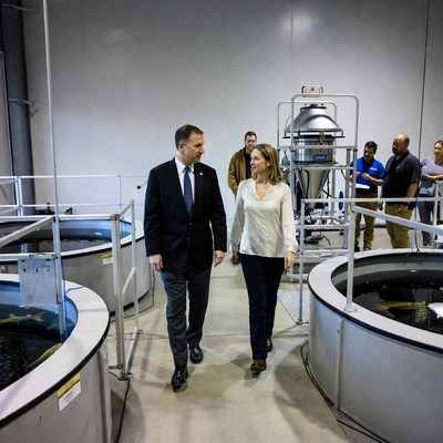 Man and woman touring fish tanks