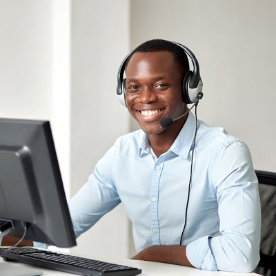 African-American man wearing headset at desk