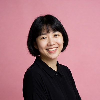 Asian woman smiling on pink background