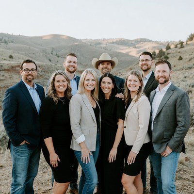 Group of professionals posing in mountains