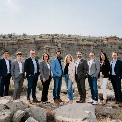 Business team standing in front of canyon