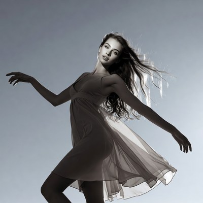 Woman dancing in flowing dress