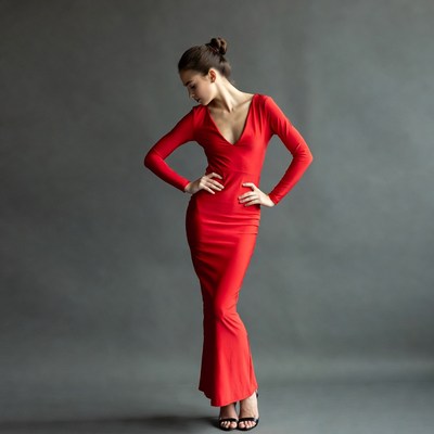 Woman in red dress posing