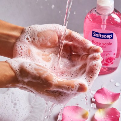 Hands washing with rose soap suds