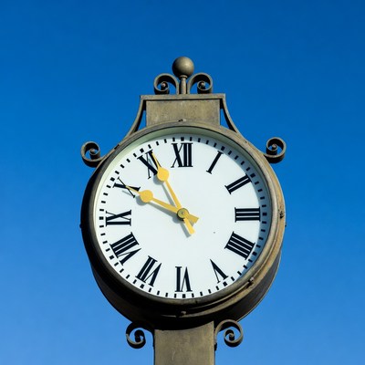 Vintage Clock Against Blue Sky
