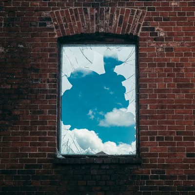 Broken window with blue sky