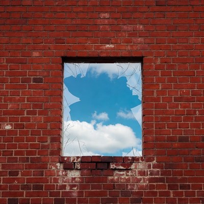 Broken Window Reflecting Blue Sky