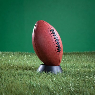 Football on green grass stand