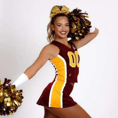 Cheerleader with pom poms posing