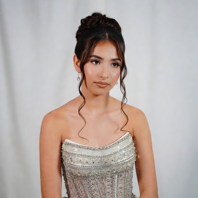 Young woman in beaded strapless gown