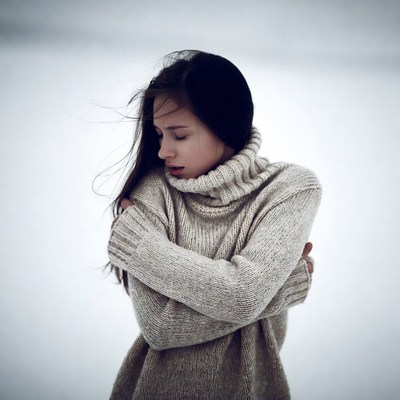 Woman in turtleneck sweater snowy landscape