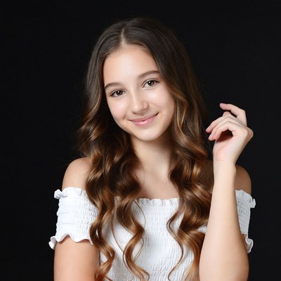 Smiling girl with wavy brown hair